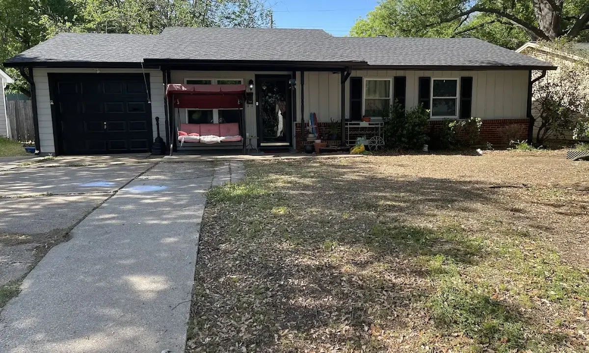Wind Damage Roof Repair crew at work on a residential roof in Savannah